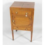 An early 19thC mahogany enclosed wash stand, the square double hinged top enclosing a fitted