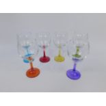 A set of six mid 20thC wine glasses with vari-coloured stem, 16cm high.