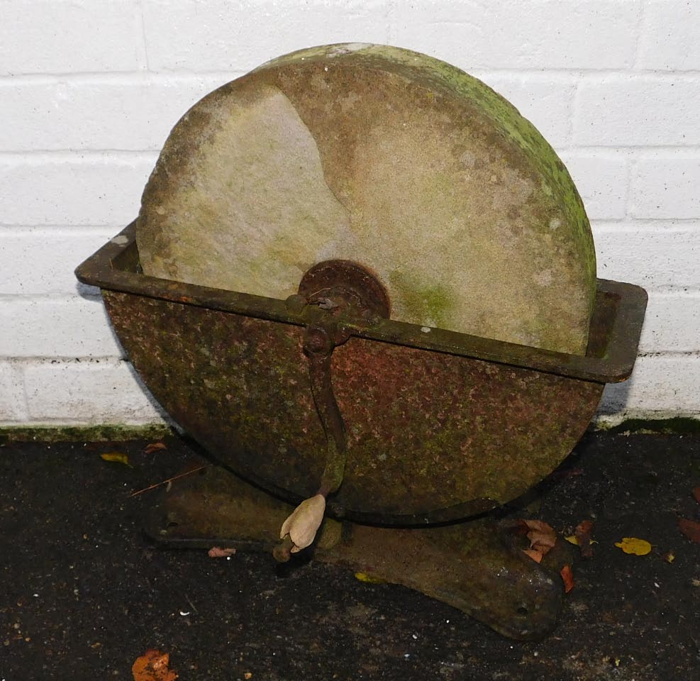 A Victorian stone and cast iron knife grinder, 49cm long.