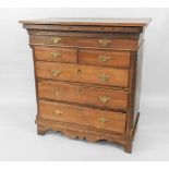 An 18thC oak chest, having frieze drawer and two short and three long drawers, probably the top