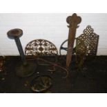 A cast iron 112 marker, wheel, two stands, pierced back plate and a boot scraper, etc.