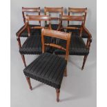 A set of nineteen early 19thC mahogany dining chairs, each with a raised bar back with ropetwist