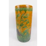 A Chinese early 20thC pottery jardiniere stand, sgraffito decorated in green with prunus and other