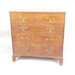 An early 19thC oak chest of drawers, the rectangular top with a moulded edge above two short and