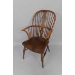 A 19thC oak and elm Windsor chair, with a Prince of Wales feather splat, H-frame stretcher, on