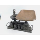 A Victorian cast iron pan balance, and assorted weights