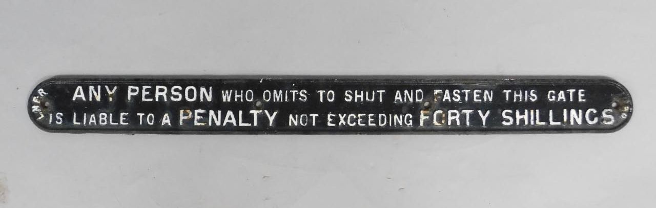 A LNER Penalty oblong black and white cast iron sign, Any Person who omits to shut and fasten this