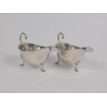 A pair of silver sauce boats, of Georgian design with leaf capped handles, 4oz.