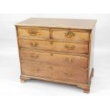 A George III mahogany chest, of two short and three long drawers, with brass handles and ogee