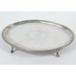 A George III silver teapot stand, probably Edward Fernell, the oval outline with a bright cut