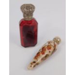 A Victorian porcelain scent bottle, of tapering form, painted with flowers, with a silver screw