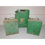 A 1946 BMP petrol can and two green metal petroleum cans.