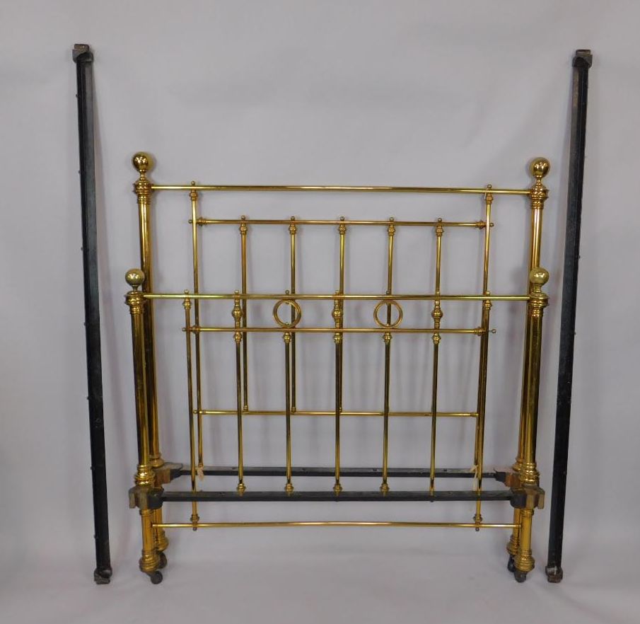 A Victorian brass double bed with side irons, 141cm wide x 204cm long.