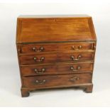 A George III mahogany bureau, the fall enclosing a fitted interior, above four graduated drawers