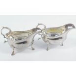 A pair of George III silver sauce boats, by William Sumner the first, each with flying acanthus leaf