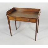 An early 19thC mahogany wash stand, with a raised gallery above a frieze drawer, with turned brass