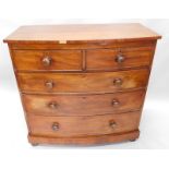 A Victorian mahogany bow fronted chest, of two short and three long drawers, on bun feet, 108cm