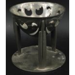 An early 20thC Liberty Tudric pewter coupe, designed by Archibald Knox, with three tapering legs,