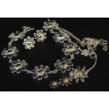 Various daisy jewellery, to include daisy bracelet, three tier drop necklace and chain, a pair of