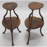 A near pair of Edwardian mahogany two tier tables, each with a heart shaped top, inlaid with