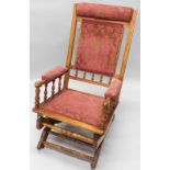 An American style 19thC rocking chair, with reeded back supports, turned spindles, and later