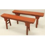 A pair of oriental benches or narrow tables, each on turned legs with rectangular tops, 48cm high,