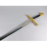 A 20thC copy of King Arthur's Excaliber sword, with an engraving to blade and gilt metal hilt etc,