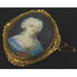 A Victorian mother of pearl backed portrait miniature of a lady, in gold plated floral surround, 9cm
