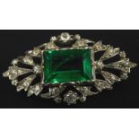 A Victorian costume jewellery brooch, with central green rectangular paste stone surrounded by