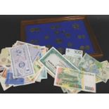 A presentation set of coins and various bank notes, to include some in uncirculated condition