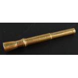 A 9ct gold cigar punch, of torch outline with articulated end, 8cm, 12g all in