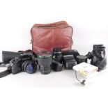 A collection of camera equipment, to include some lenses etc.