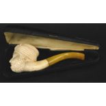 A Meerschaum pipe, the cased stamped Duncan Genuine Meerschaum, modelled in the form of an Arab type