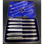 A collection of small silver etc., to include sugar tongs and a set of silver handled dessert