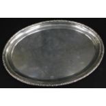 A German white metal oval tray, with a leaf cast border, stamped to the reverse GEBR.FRIEDLANDER