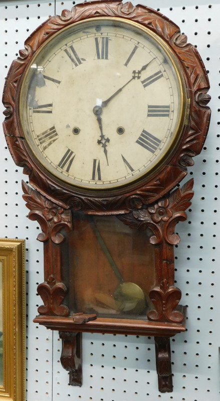 A 19thC mahogany wall clock, with painted dial, the case carved with leaves etc, possibly