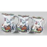 A set of three Ashworth Bros Ironstone hydra type jugs, each decorated with oriental landscapes