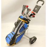 A collection of Ben Sayers golf clubs, to include four woods, a putter, and a Fazer bag with