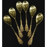 A set of six Continental gilt white metal teaspoons, each with an elaborate cast handle and an