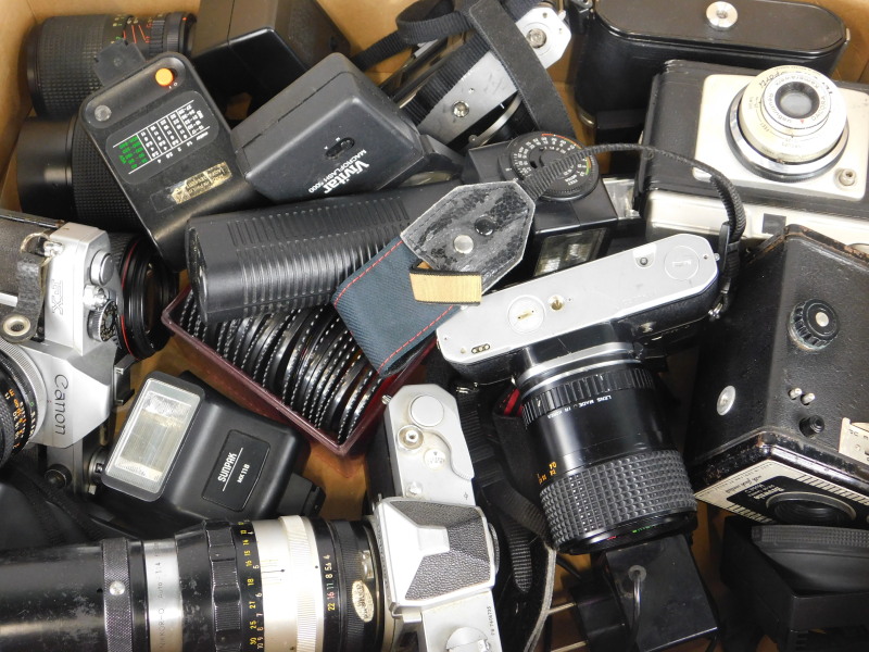 Various cameras and lenses, to include Pentax, Nikkor, Canon etc.