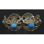 A floral costume jewellery bracelet, set with blue stones in the form of daisies, silver plated