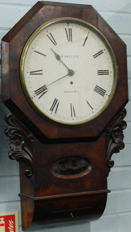 H. Kellett, Bradbury. A late 19thC drop dial wall clock, the figured mahogany case carved with