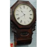 H. Kellett, Bradbury. A late 19thC drop dial wall clock, the figured mahogany case carved with