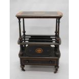 A late Victorian ebonised and amboyna Canterbury whatnot, the rectangular top with moulded edge,