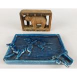 An unusual Black Forest type figure of a bear, in a pine case or cage, 9cm wide and a blue enamel