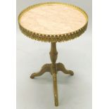 A Continental beech occasional table, the circular top with a gilt metal gallery and a marble inset,