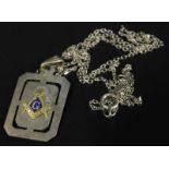 A Masonic pendant and chain, with pendant of rectangular form, with blue enamel and Masonic symbol