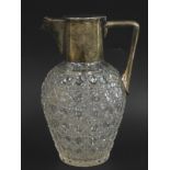 A late Victorian cut glass and silver mounted claret jug, with angular handle, star cut base, hall