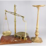 An early 20thC set of brass and mahogany scales, with weights and a weighted giltwood and metal