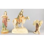 A Royal Dux porcelain figure of a lady carrying a basket, and two other similar figures of a lady on